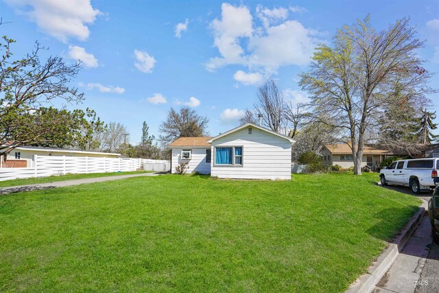 1817 Granada Dr, Twin Falls, ID 83301 - view of side of home with fence and a lawn