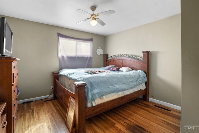 1817 Granada Dr, Twin Falls, ID 83301 - bedroom featuring visible vents, baseboards, a ceiling fan, and wood finished floors