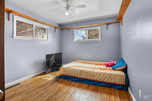 1817 Granada Dr, Twin Falls, ID 83301 - bedroom with baseboards, a ceiling fan, visible vents, and hardwood / wood-style flooring