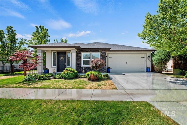9753 W Wildbranch, Star, ID 83669 - prairie-style home with an attached garage, concrete driveway, and stone siding