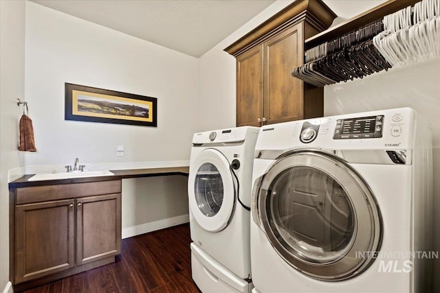 9753 W Wildbranch, Star, ID 83669 - washroom featuring washing machine and clothes dryer, cabinet space, and dark wood-style floors
