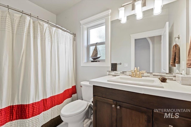 9753 W Wildbranch, Star, ID 83669 - bathroom with vanity, backsplash, and a shower with curtain