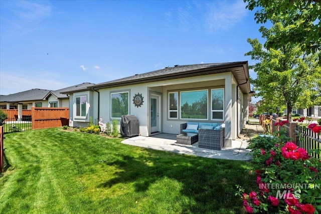 9753 W Wildbranch, Star, ID 83669 - back of house featuring a fenced backyard, a patio, stucco siding, and outdoor lounge area