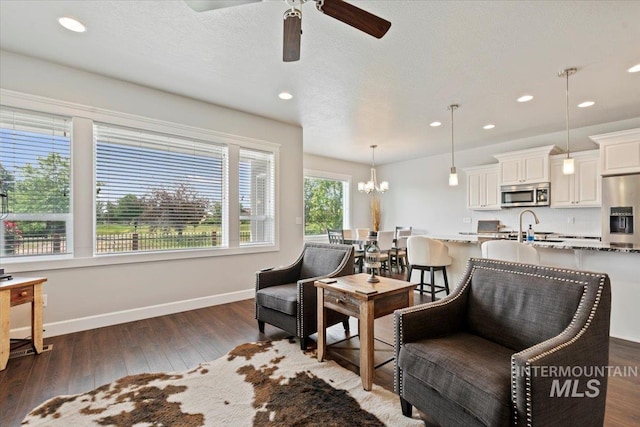 9753 W Wildbranch, Star, ID 83669 - living room featuring ceiling fan, dark wood finished floors, a chandelier, and recessed lighting