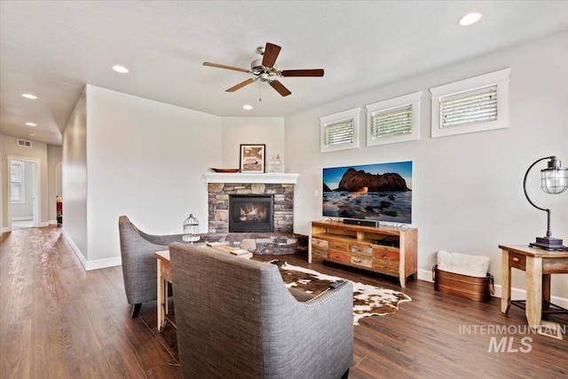 9753 W Wildbranch, Star, ID 83669 - living area featuring a ceiling fan, wood finished floors, recessed lighting, a fireplace, and healthy amount of natural light