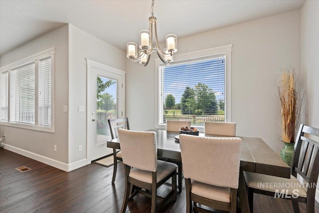 9753 W Wildbranch, Star, ID 83669 - dining room featuring dark wood finished floors and a chandelier