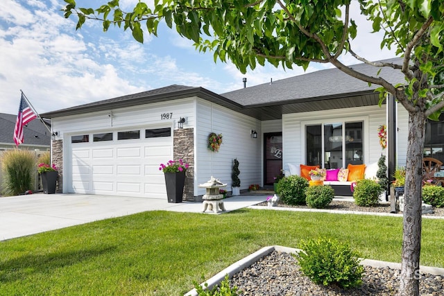 1987 S Defio Way, Meridian, ID 83642 - ranch-style home with an attached garage, driveway, a front yard, and stone siding