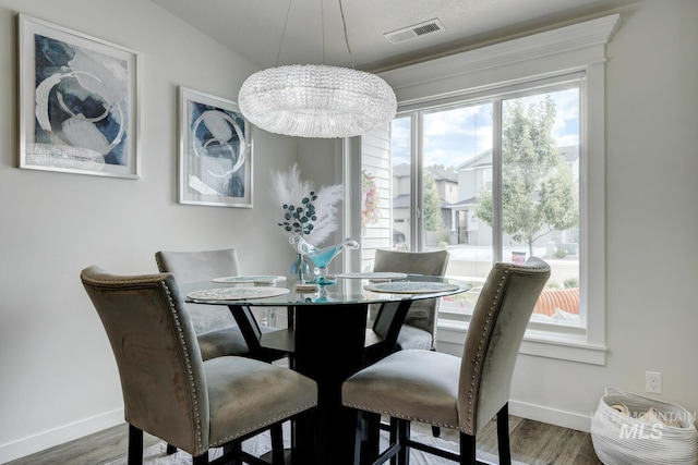 1987 S Defio Way, Meridian, ID 83642 - dining room with wood finished floors and a chandelier