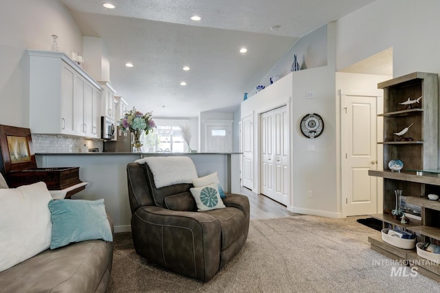 1987 S Defio Way, Meridian, ID 83642 - carpeted living room featuring vaulted ceiling and recessed lighting