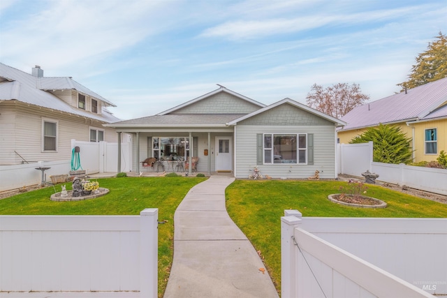 view of front of home with a porch and a front lawn