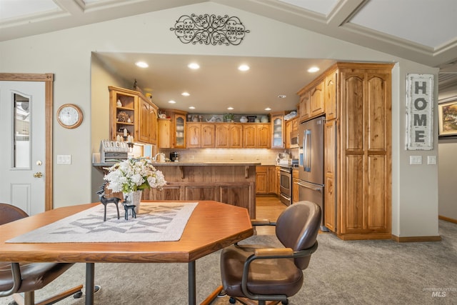 dining space with light carpet and vaulted ceiling