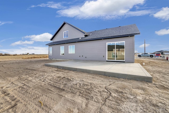 back of property featuring a patio