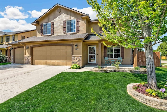 5375 N Isla Ave, Meridian, ID 83646 - view of front of house featuring concrete driveway, a porch, stone siding, and an attached garage