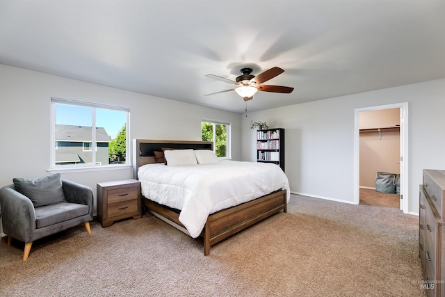 5375 N Isla Ave, Meridian, ID 83646 - bedroom with light carpet, a ceiling fan, baseboards, and a walk in closet