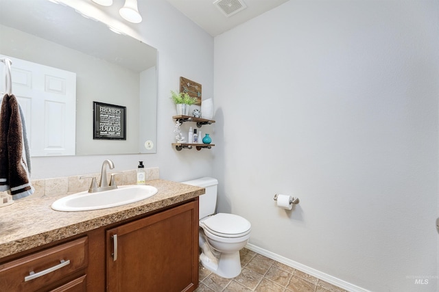 5375 N Isla Ave, Meridian, ID 83646 - bathroom featuring vanity, baseboards, and toilet