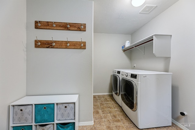 5375 N Isla Ave, Meridian, ID 83646 - laundry room featuring washer and clothes dryer and baseboards