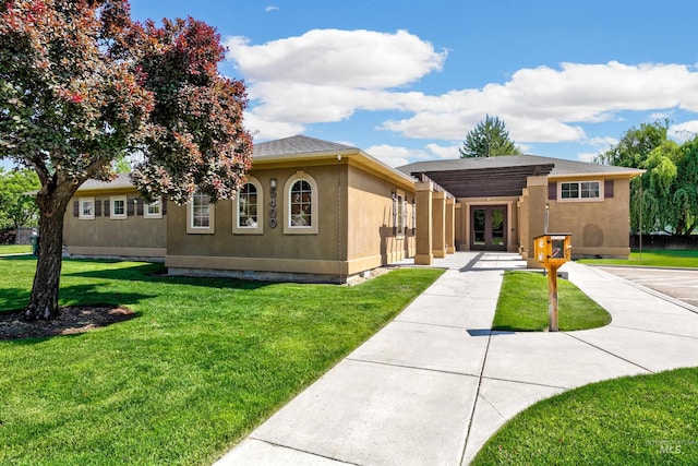 5375 N Isla Ave, Meridian, ID 83646 - view of front facade featuring french doors, a front lawn, stucco siding, and a shingled roof