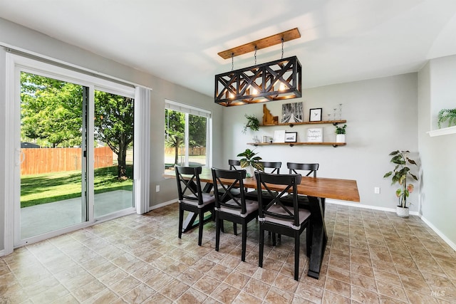 5375 N Isla Ave, Meridian, ID 83646 - dining area with baseboards and light stone finish flooring