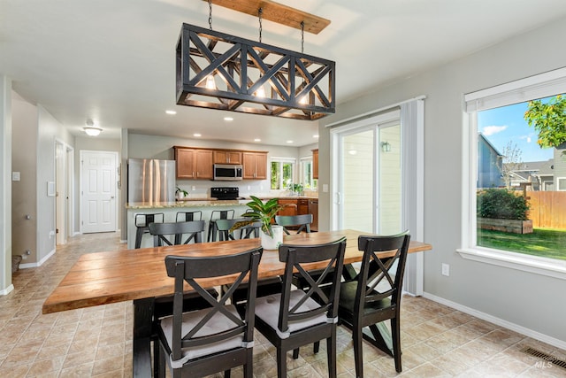5375 N Isla Ave, Meridian, ID 83646 - dining space with baseboards and recessed lighting
