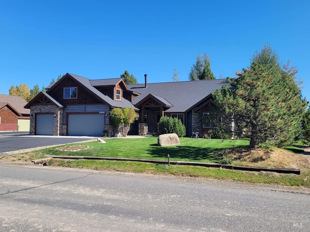 craftsman-style house with a garage and a front yard