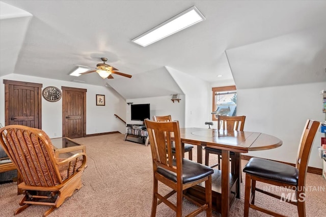 dining room featuring vaulted ceiling, ceiling fan, and carpet floors