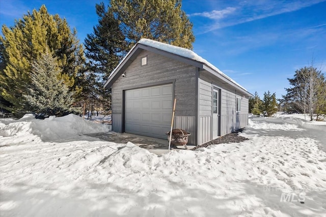 view of snow covered garage