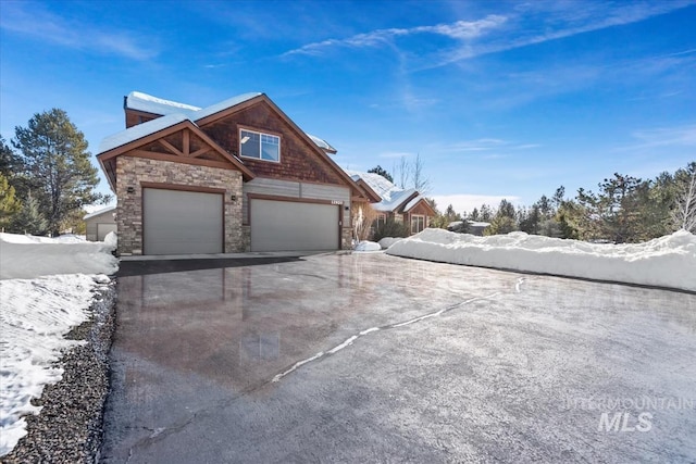 view of snow covered exterior featuring a garage