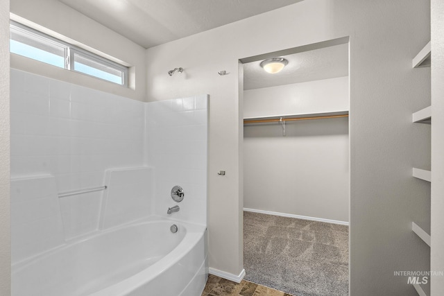 bathroom with shower / bathing tub combination