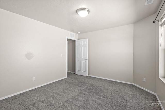 unfurnished room with carpet flooring