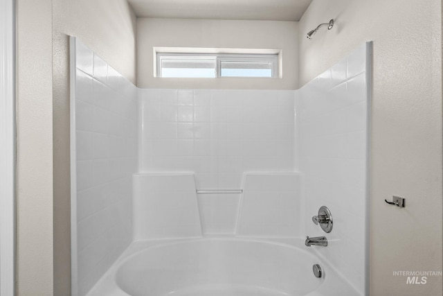 bathroom with shower / tub combination