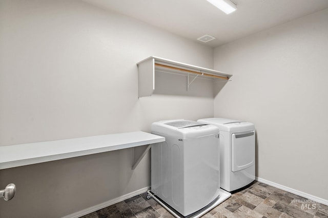 washroom featuring independent washer and dryer