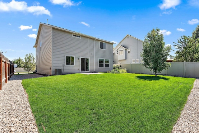 back of house with a yard