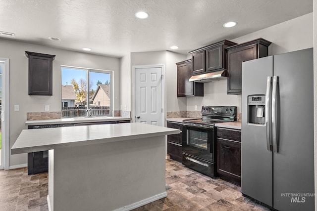 kitchen with stainless steel fridge, dark brown cabinets, black electric range, a center island, and sink