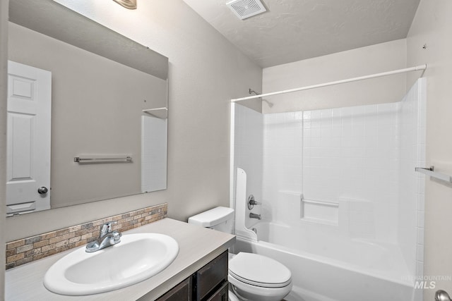 full bathroom featuring vanity, toilet, tub / shower combination, and decorative backsplash