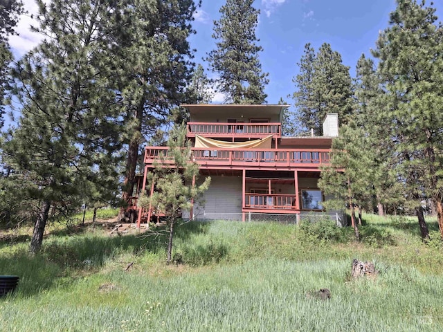 8 Lookout Rd, Garden Valley, ID 83622 - back of house featuring a wooden deck and a chimney