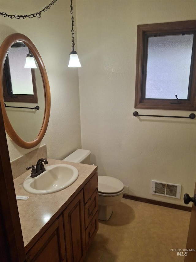 8 Lookout Rd, Garden Valley, ID 83622 - bathroom with toilet, vanity, healthy amount of natural light, and baseboards