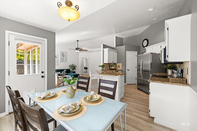512 S Pelican Way, Meridian, ID 83642 - dining area with vaulted ceiling, ceiling fan, and light wood-style flooring