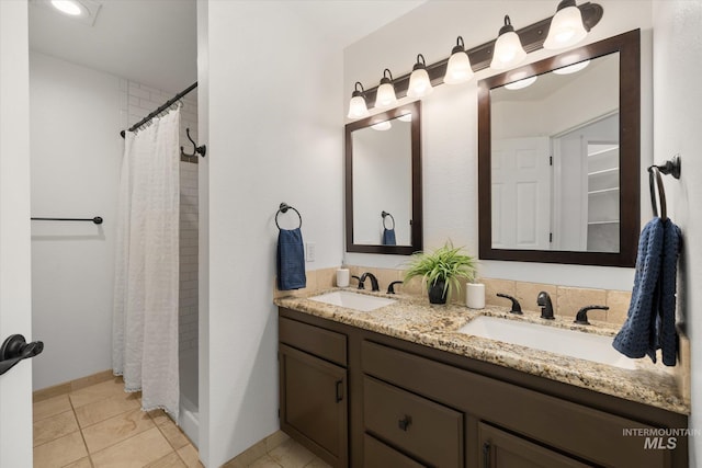 512 S Pelican Way, Meridian, ID 83642 - bathroom with double vanity, a shower with curtain, baseboards, and tile patterned floors