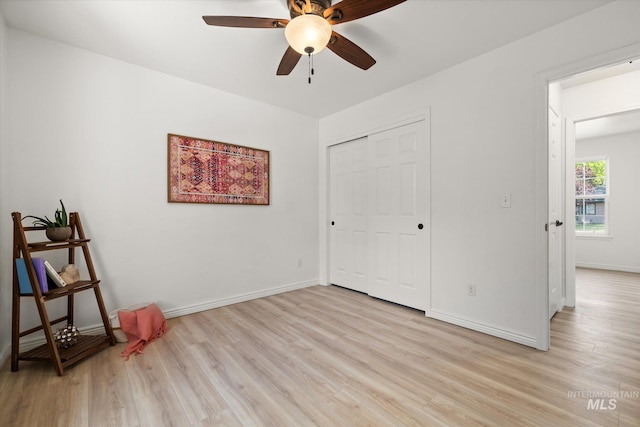 512 S Pelican Way, Meridian, ID 83642 - unfurnished bedroom featuring light wood-type flooring, baseboards, a closet, and ceiling fan