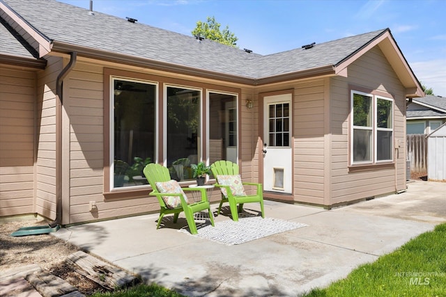 512 S Pelican Way, Meridian, ID 83642 - rear view of house featuring a patio area and a shingled roof