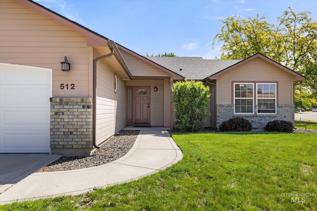 512 S Pelican Way, Meridian, ID 83642 - view of front of home with an attached garage, a front yard, and roof with shingles