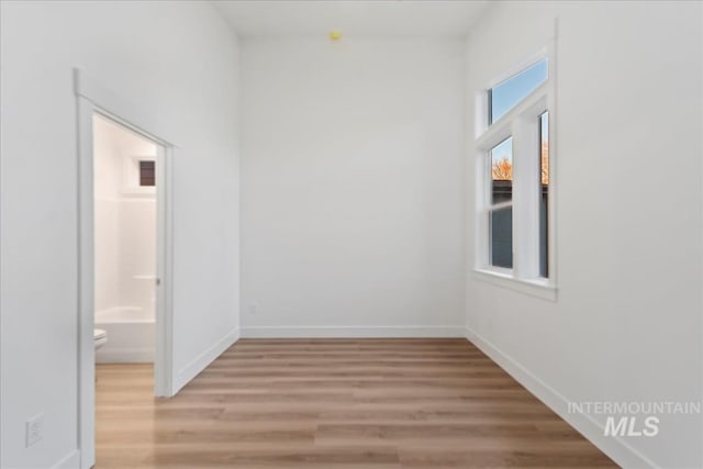 empty room with hardwood / wood-style floors