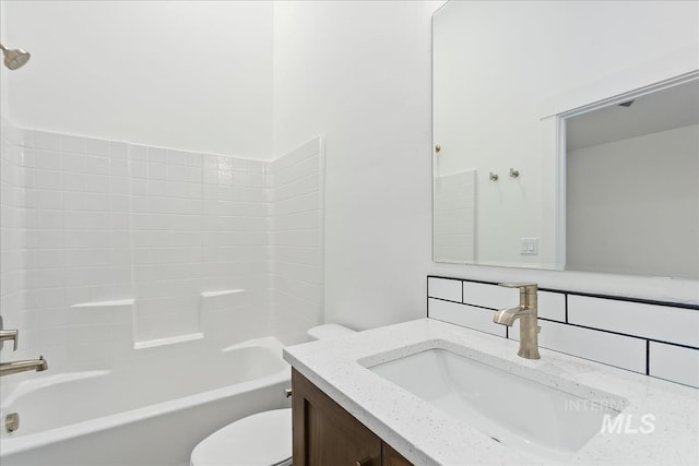 full bathroom featuring vanity, tub / shower combination, and toilet