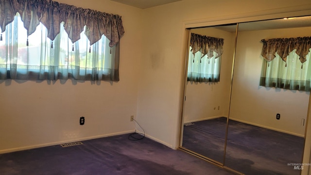 17 W 208 S, Burley, ID 83318 - unfurnished bedroom with a closet, carpet floors, multiple windows, and baseboards