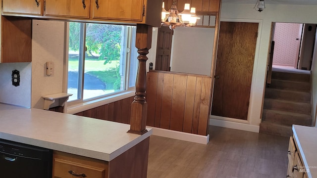 17 W 208 S, Burley, ID 83318 - kitchen featuring wood finished floors, light countertops, a chandelier, brown cabinets, and black dishwasher