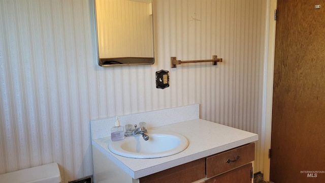 17 W 208 S, Burley, ID 83318 - bathroom featuring wallpapered walls and vanity