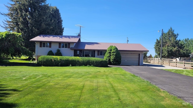 17 W 208 S, Burley, ID 83318 - split level home with an attached garage, asphalt driveway, and metal roof