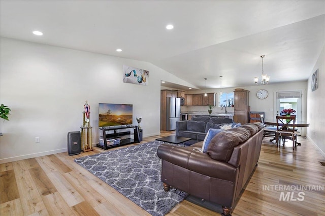 190 Bison Way, Fairfield, ID 83327 - living room featuring light wood-style flooring, vaulted ceiling, baseboards, recessed lighting, and a chandelier