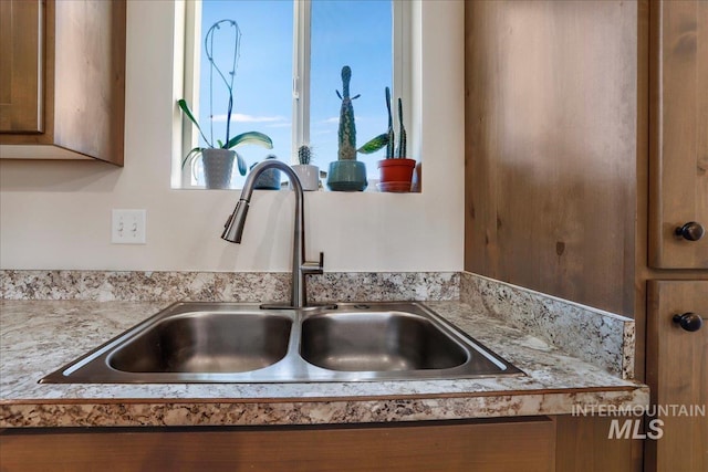 190 Bison Way, Fairfield, ID 83327 - kitchen view of a sink, light countertops, and brown cabinetry