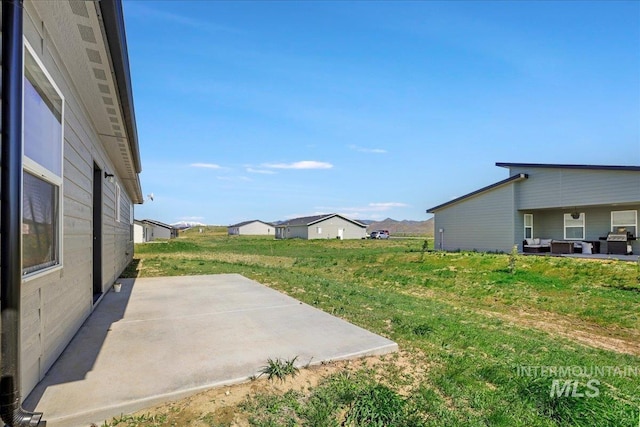 190 Bison Way, Fairfield, ID 83327 - view of green lawn featuring a patio